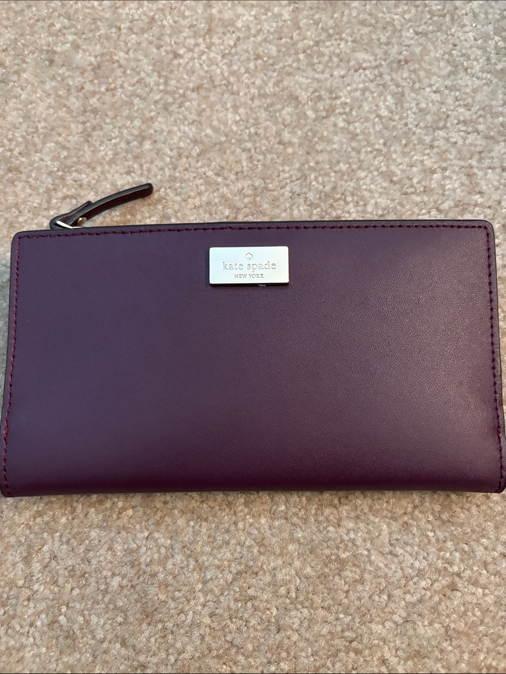 kate spade Plum Zip Leather Wallet with Silver Plaque